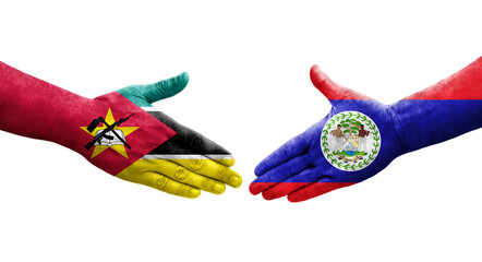 Handshake between Belize and Mozambique flags painted on hands, isolated transparent image.