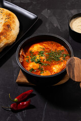 shakshuka on a dark background