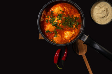 shakshuka on a dark background