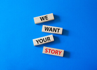We want your story symbol. Concept words We want your story on wooden blocks. Beautiful blue background. Business and We want your story concept. Copy space.