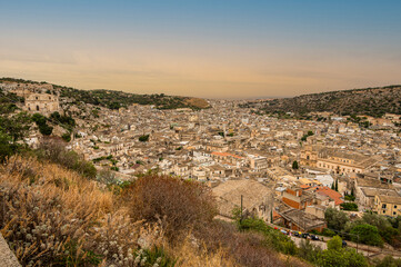 Obraz premium aerial landscape of Scicli with beautiful historic buildings in the Baroque style at sunset