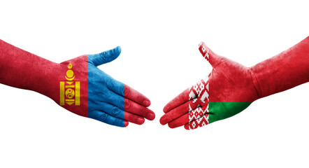 Handshake between Belarus and Mongolia flags painted on hands, isolated transparent image.