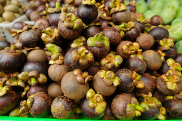 Mangosteen - Close up detail of the mangosteen fruit. Mangosteen fruit in large quantities in the basket