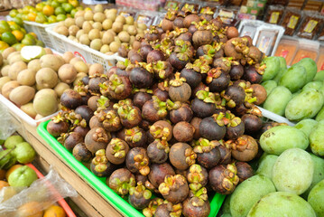 Mangosteen - Close up detail of the mangosteen fruit. Mangosteen fruit in large quantities in the basket
