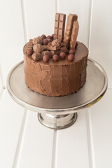 sweet food details, chocolate cake decorated with chocolates, cake shop with appetizing dessert, birthday celebration