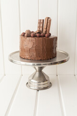 elegant decoration of chocolate cake decorated with chocolates, cake shop with appetizing dessert, celebration for birthday, studio