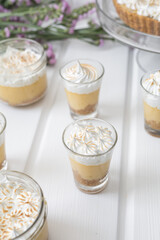 coffee dessert with cream in a glass cup, table decoration with snacks ready for celebration, gourmet appetizers