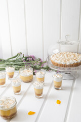 cake and coffee dessert with cream in a glass cup, table decoration with ready snacks, gourmet snacks in studio, delicious food