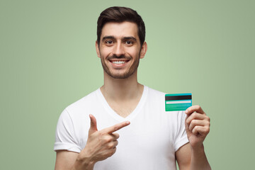 Man in white t-shirt showing credit card