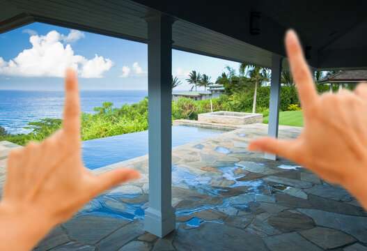 Female Hands Framing a Breathtaking Hawaiian Ocean View Deck and Swimming Pool
