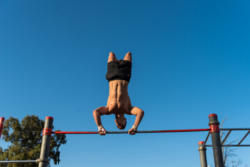 sportsman doing outdoor gymnastics, athlete, calisthenics