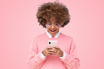 Shocked happy african girl with wow face, holding phone with both hands, surprised by message