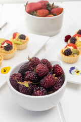 red berries as a cooking ingredient, appetizing cake, decorated gourmet food, fresh fruits in studio