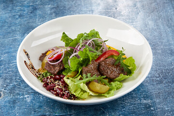 beef salad on the blue background