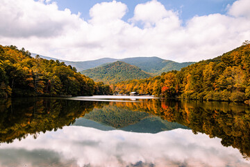 autumn in the mountains with reflections in lake water at Vogel state park, Georgia