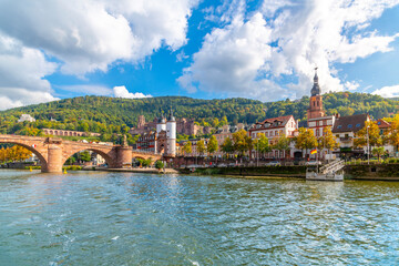 Fototapeta premium The Karl Theodor Bridge, commonly knows as the Old Bridge, and the Bridge Gate along the Neckar River in the Bavarian city of Heidelberg. 