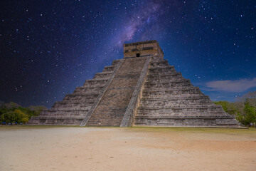 Temple Pyramid of Kukulcan El Castillo with Milky Way Galaxy stars night sky, Chichen Itza, Yucatan, Mexico, Maya civilization