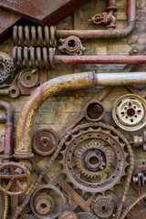 Fototapeta na wymiar old rusty gear wheels, heavy industry