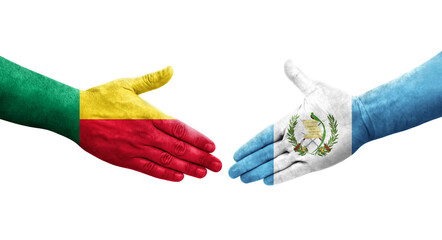 Handshake between Benin and Guatemala flags painted on hands, isolated transparent image.