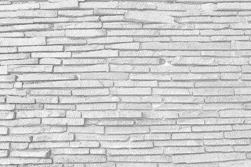 pattern of decorative white slate stone wall surface. Surface white wall of stone wall gray tones for use as background.