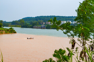 A sailor drives a speedboat at the confluence of two rivers