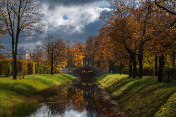 Cross bridge (Krestovy bridge) in the Alexander Park of Tsarskoye Selo on a sunny autumn day,...