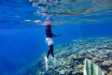 Snorkeling at the Kerama Islands in Okinawa. - obrazy, fototapety, plakaty