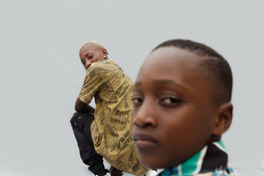 Blonde African father looking back at son 