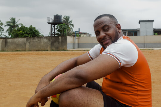 Man taking a break from soccer training 
