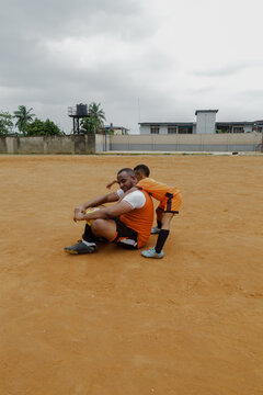 Father and son taking a break on soccer field