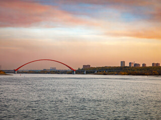 Bugrinsky Bridge over the River Ob in big city Novosibirsk, Russia, sunrise or sunset, evening view