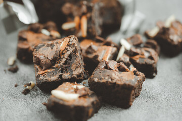 Delicious and crunchy homemade chocolate brownie topped with almond and chocolate chips