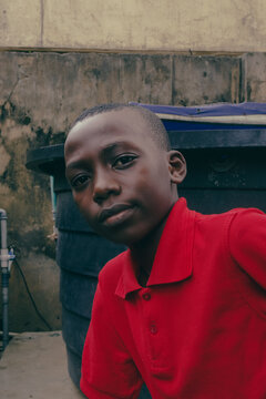 Portrait of Nigerian boy from Delta State in a red shirt