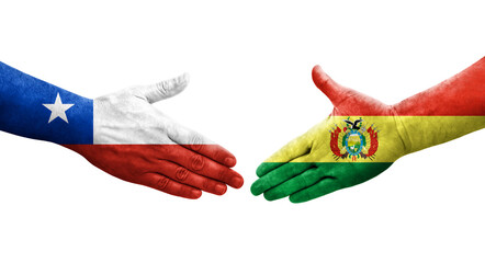 Handshake between Bolivia and Chile flags painted on hands, isolated transparent image. - obrazy, fototapety, plakaty