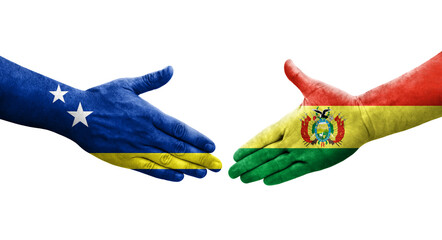 Handshake between Bolivia and Curacao flags painted on hands, isolated transparent image.