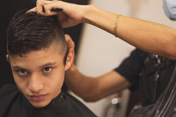 A boy in the barbershop