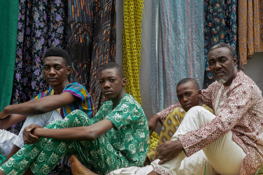 Portrait of African family, Father and sons sitting