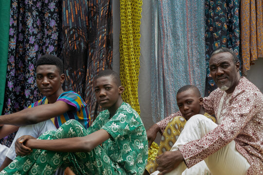 Portrait of African family, Father and sons sitting