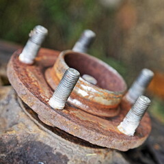 Used car steering knuckle with rusty hub without brake disc when car brakes repair
