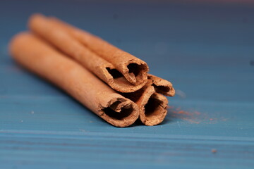 Cinnamon sticks on a blue background