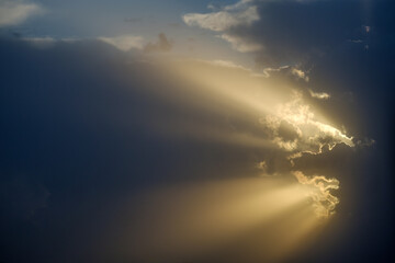 the rays of the sun through the cloud