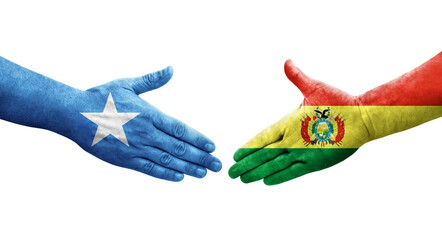 Handshake between Bolivia and Somalia flags painted on hands, isolated transparent image.