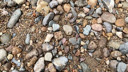 Light brown rock texture. Rough mountain surface. Close-up. Beige stone background with space for design. Web banner. Wide. Panoramic. Sandstone. Solid, rocky, slate.