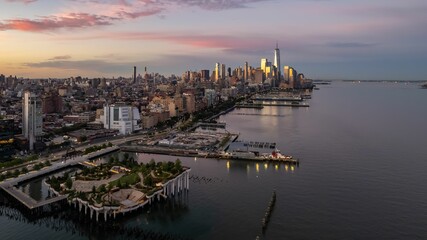 Aerial of the Little Island public park and New York City  skyscrapers on the Hudson river