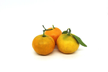 Fresh orange fruits isolated against a white background

