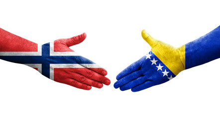 Handshake between Bosnia and Norway flags painted on hands, isolated transparent image.