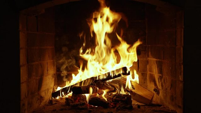 Cozy relaxing fireplace. UHD TV screen saver. Video for meditation. A Looping Clip of a Fireplace with Medium Size Flames Christmas Holidays Concept.
