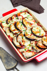 Baked eggplant with cheese mozzarella and tomatoes. Healthy eating. Italian food. Parmigiana di melanzane.