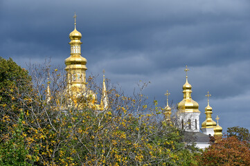 Fototapeta na wymiar Domes of the Kiev-Pechersk Lavra in the city of Kyiv 