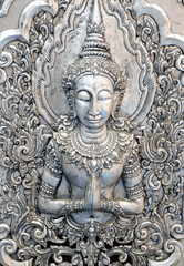 Fototapeta na wymiar Thai style silver carving art on temple wall , Wat Srisuphan ,Chiang Mai, Thailand